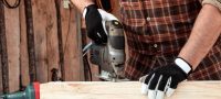 man-carpenter-cuts-wooden-beam-using-electric-jigsaw-male-hands-with-electric-jigsaw-closeup_99433-2454__2_